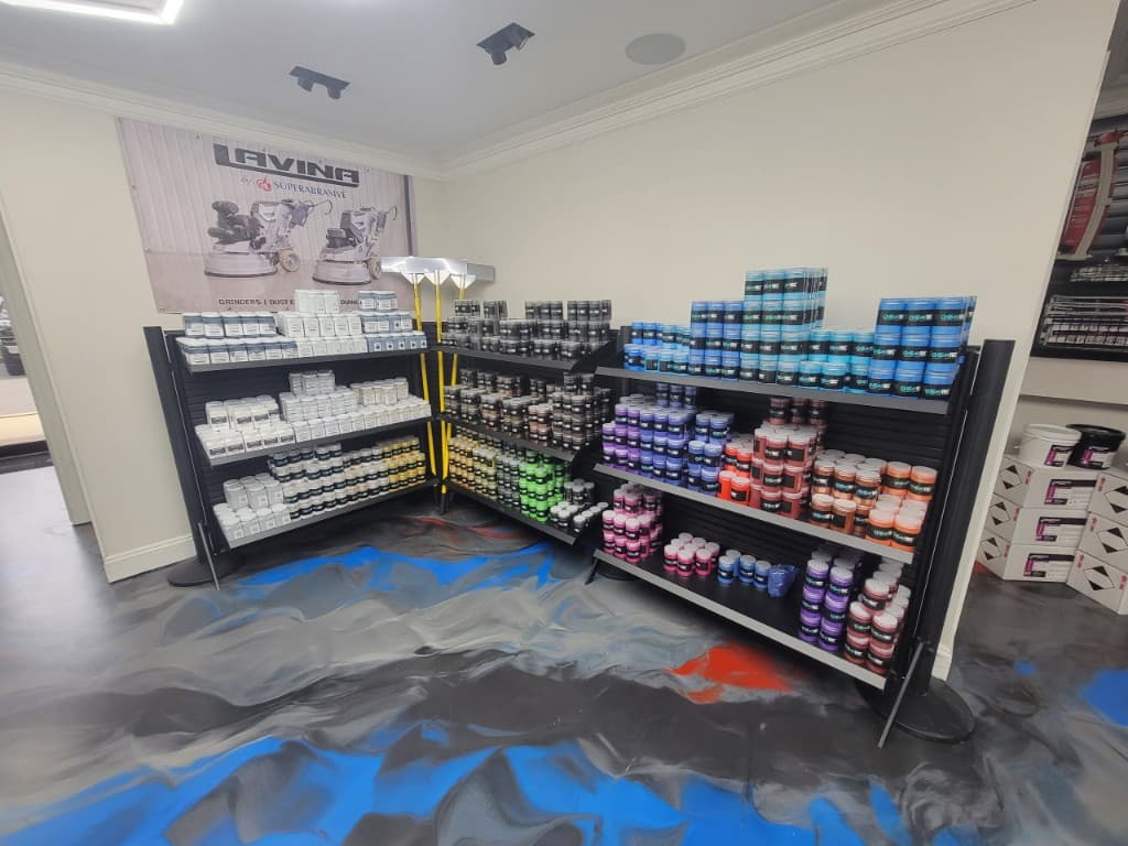 Wall of epoxy flake color jars and chip samples at All Island Epoxy supply store