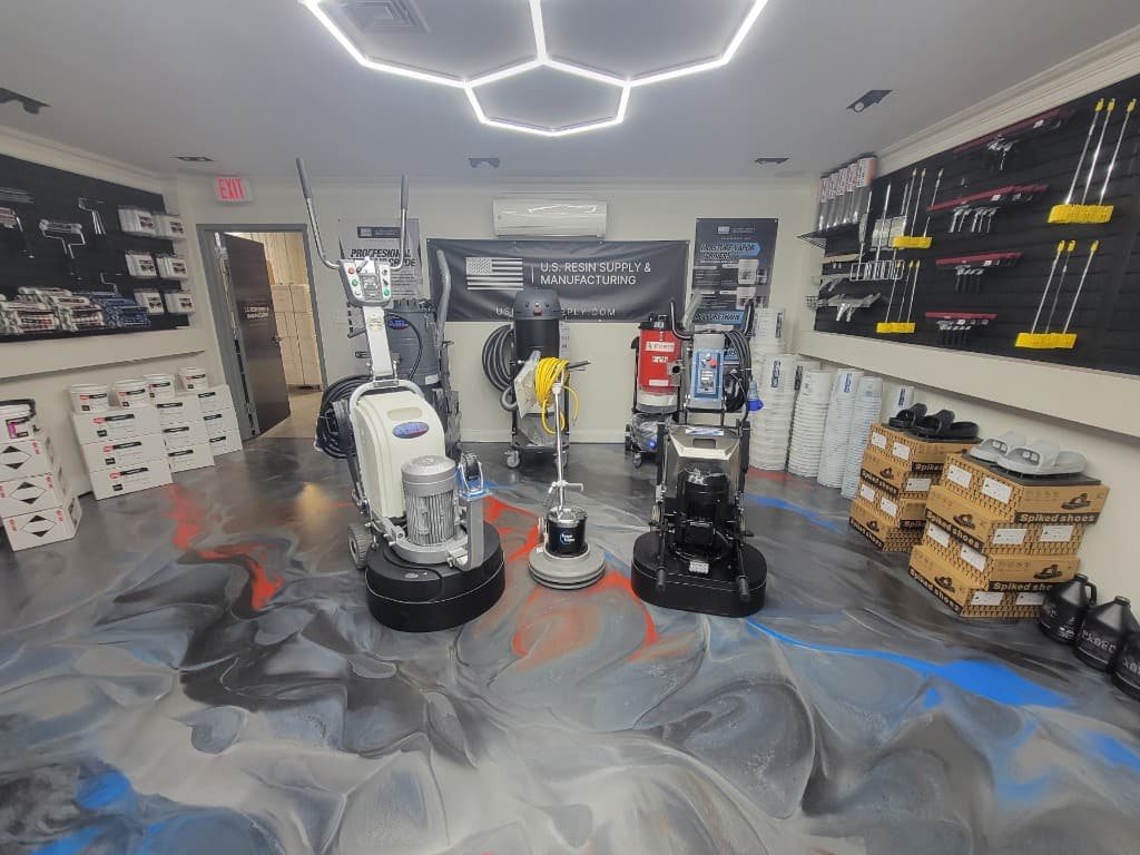Concrete grinders, polishers, and prep equipment on display in Bohemia epoxy supply store